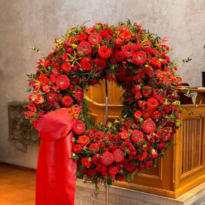 Funeral wreath in red summer flowers